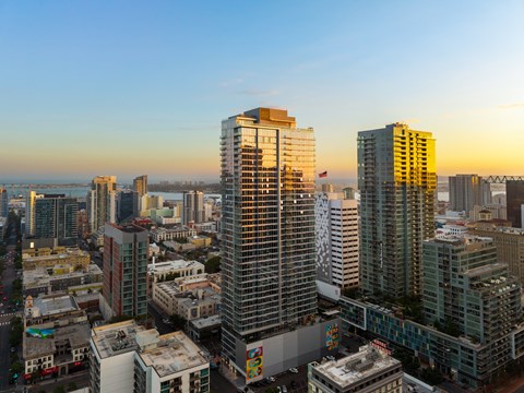 A cityscape with tall buildings and a clear sky.