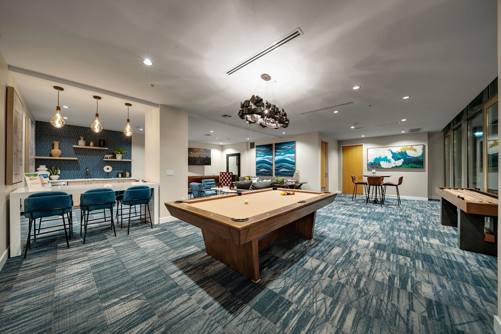 play a game of pool in our game room at our apartments