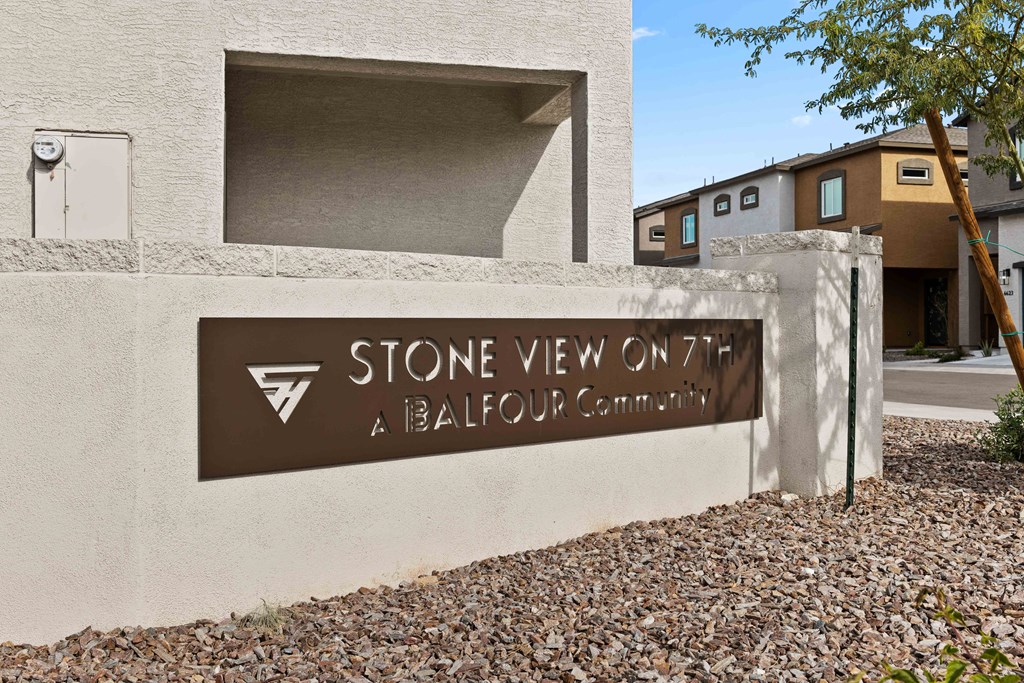 a building with a stone view on a battleground community sign