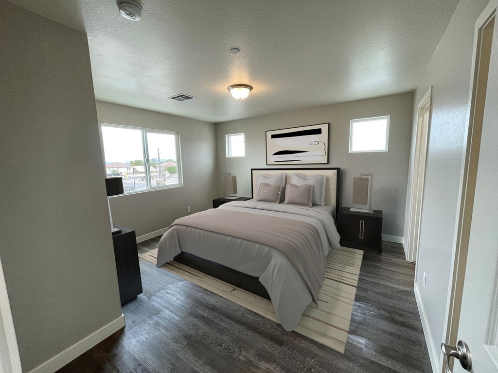 a bedroom with a bed and a window