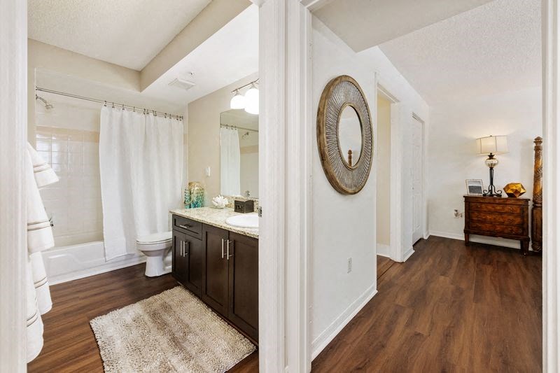 a bathroom with a sink and a toilet and a mirror