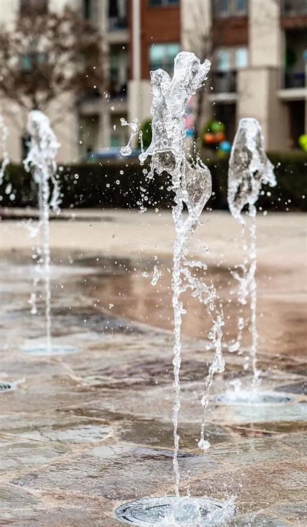 a fountain is spraying water into the air