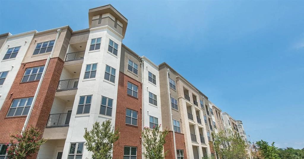 a large brick building with a tower on top of it