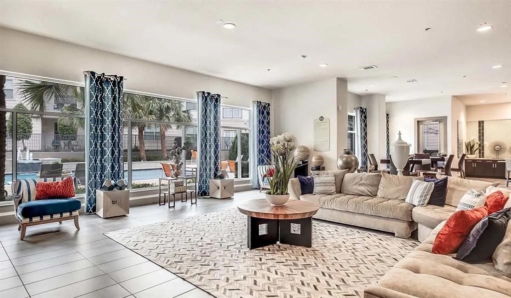 a large living room with couches and a table