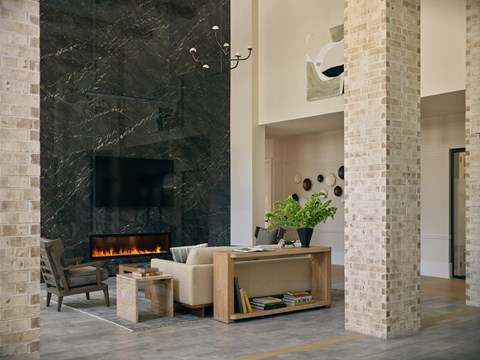 A living room with a fireplace and a chair.