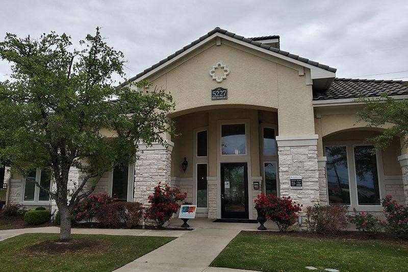a building with a tree in front of it