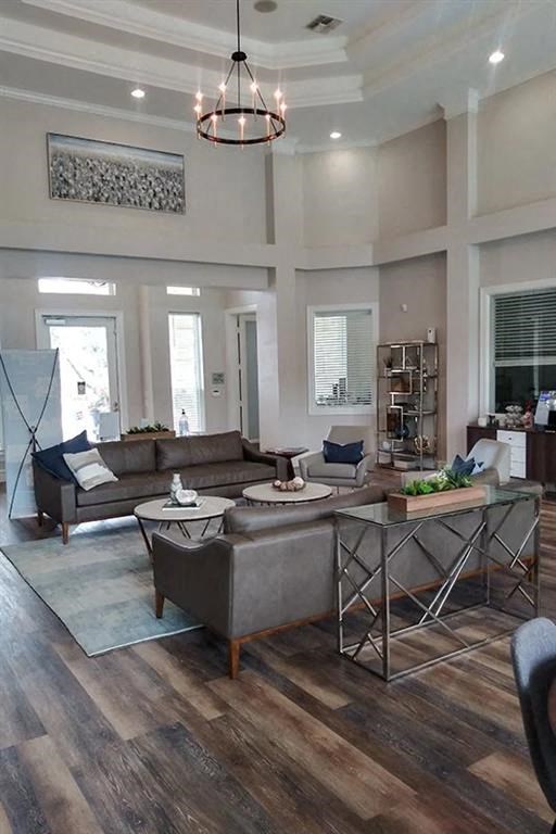 a living room with couches and chairs and a table