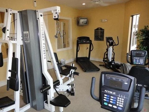 a gym with a lot of equipment in it