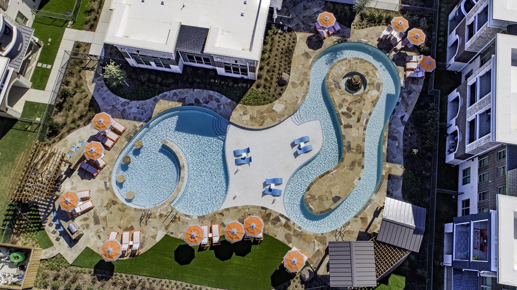 an aerial view of a swimming pool in a city