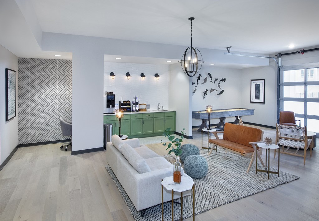 a living room with white walls and hardwood floors
