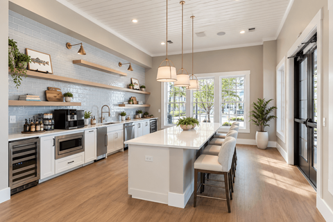 A modern kitchen with a long island in the middle.