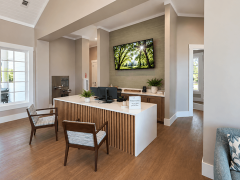 A reception area with a white reception desk and two chairs.