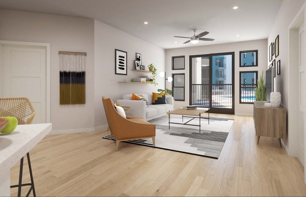 a living room filled with furniture and a large window