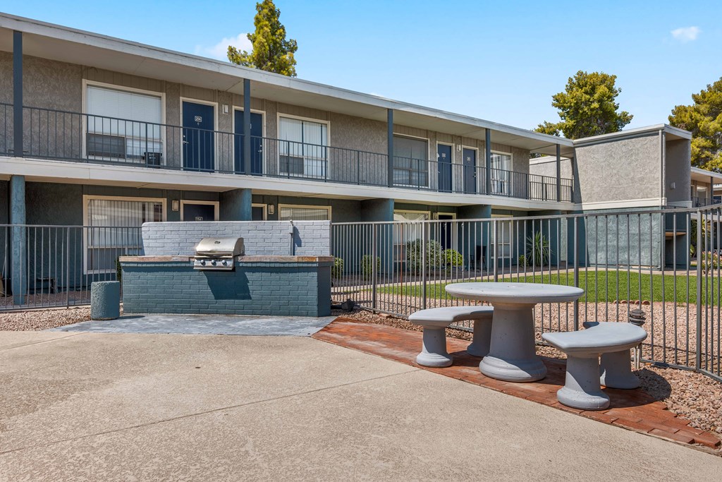 our apartments have a patio with a fire pit and tables