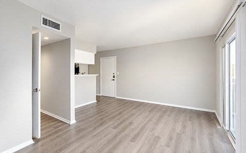 A room with a white door and a window.
