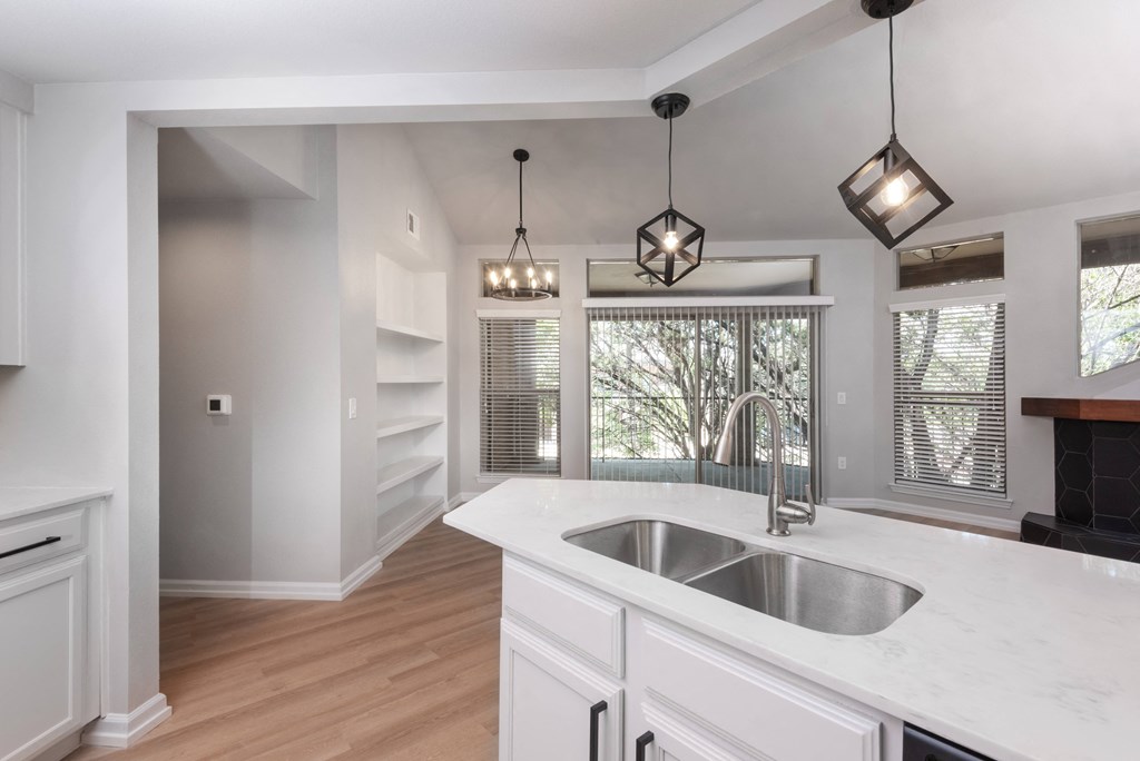 a kitchen with a sink and a window