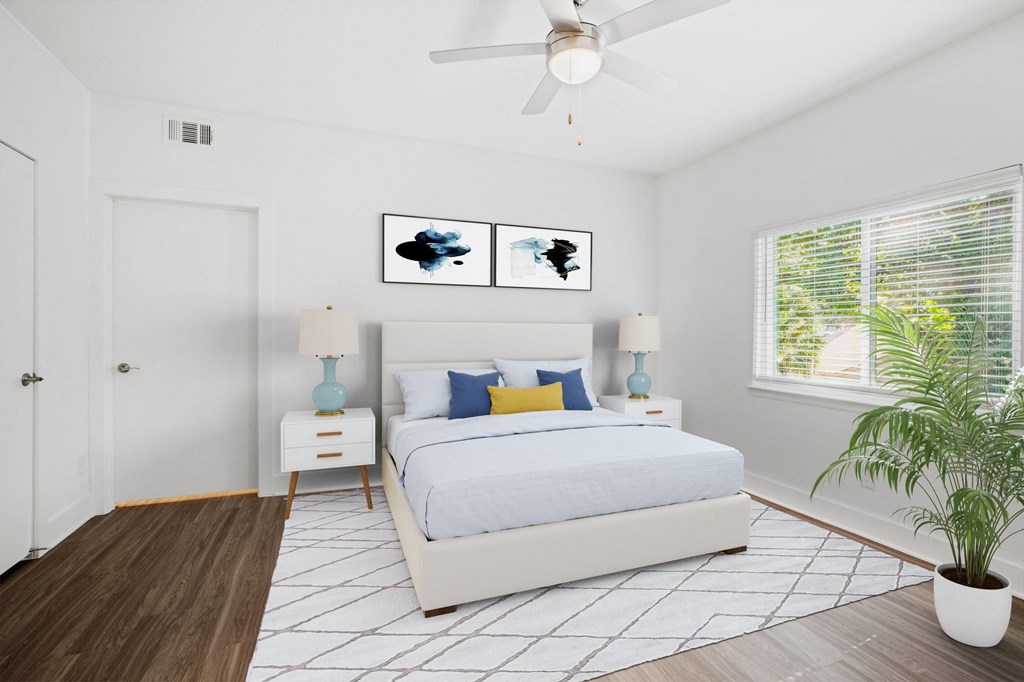 A white bedroom with a full sized bed and mattress