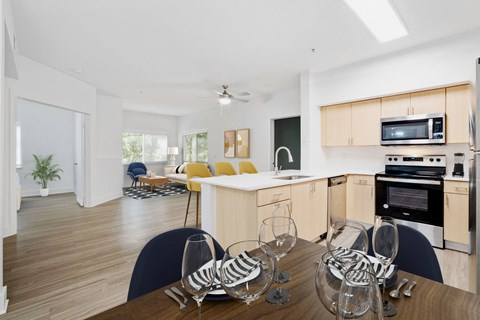 a kitchen and dining room with a table and chairs