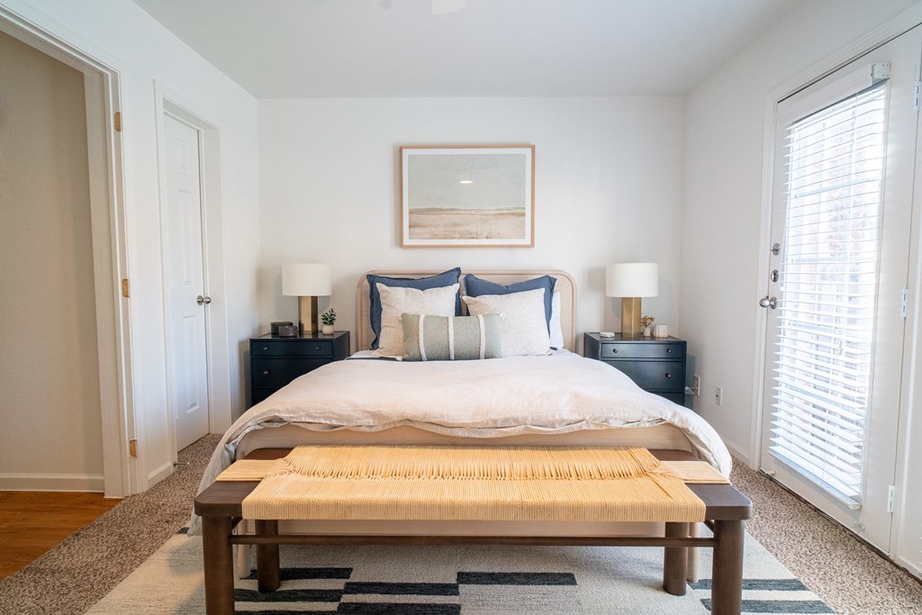 a bedroom with a bed and a coffee table