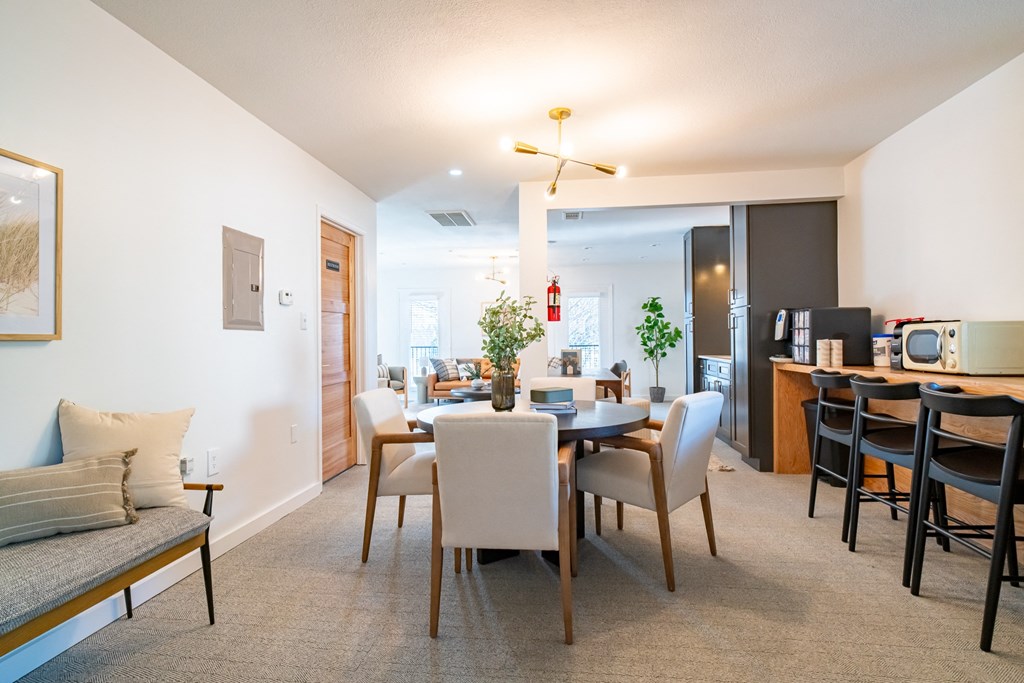 an open living room and dining room with a table and chairs and a living room