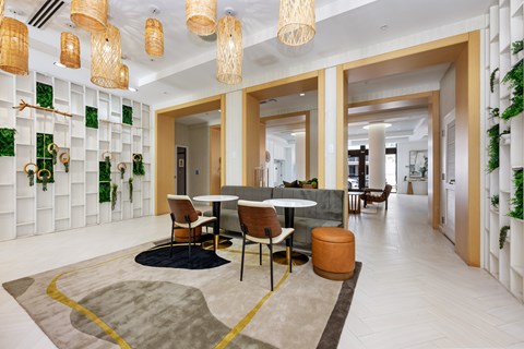 A modern dining area with a round table and chairs.