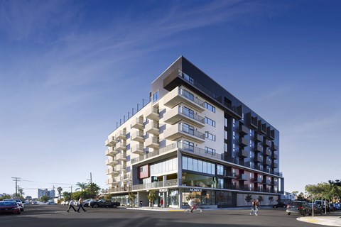A modern multi-story building with a black and white facade.