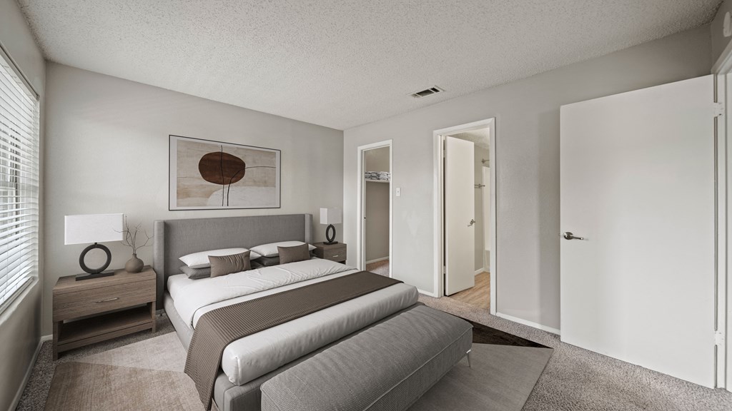 a bedroom with a large bed and a closet