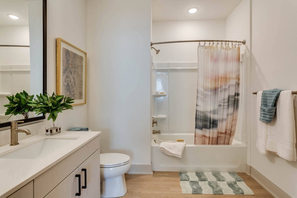 Contemporary Bathroom with LED Lighting and Oversized Mirrors