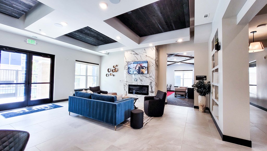 a living room with a couch and a fireplace