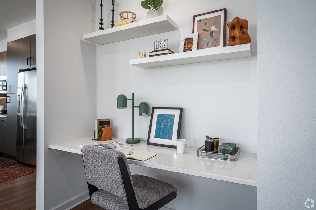 a home office with a desk and a chair
