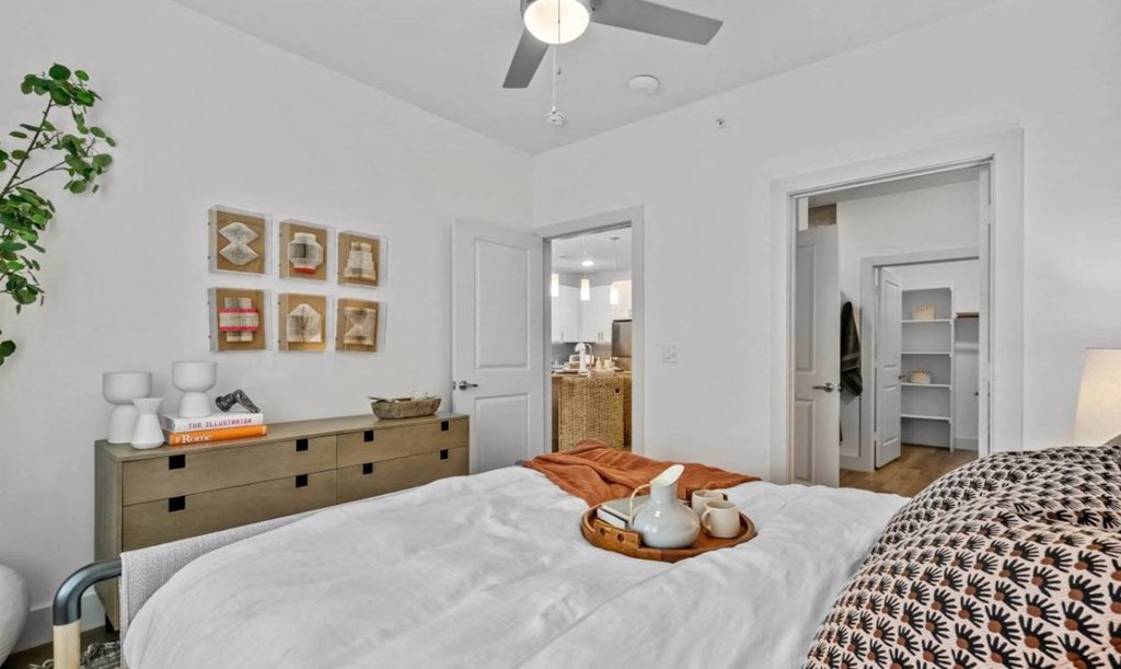 a bedroom with a large bed and a closet