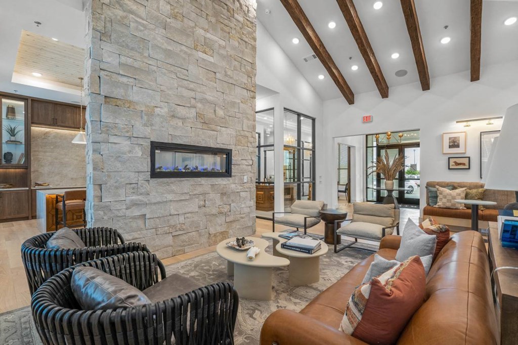 a living room with couches and a fireplace