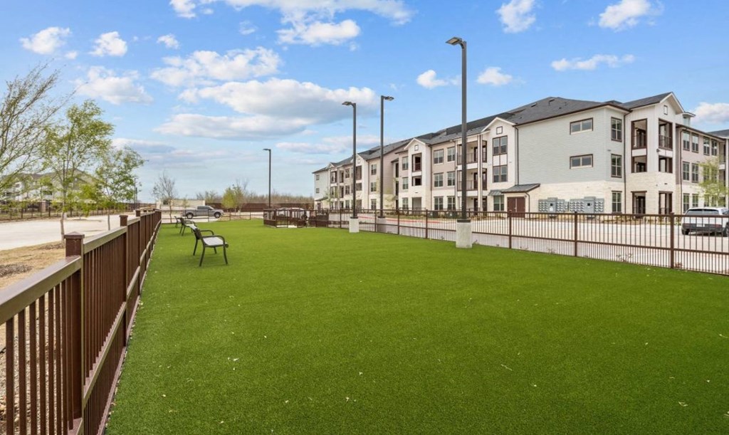 a rendering of a row of houses with people silhouettes in the sky