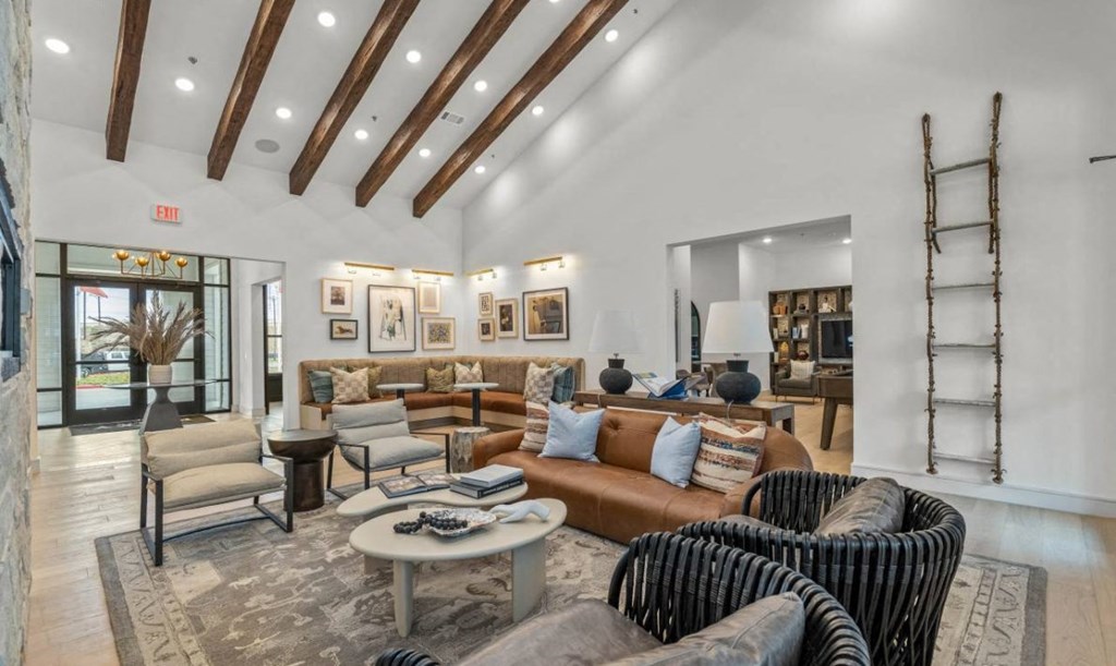 a living room with couches and chairs and a fireplace