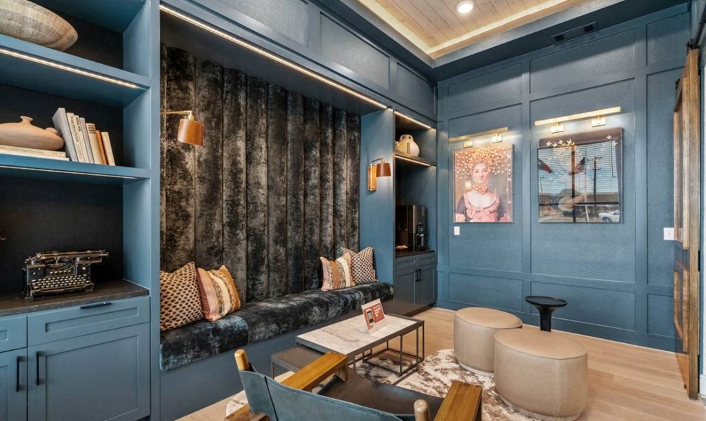 a group of men are standing in a room with a ceiling of people