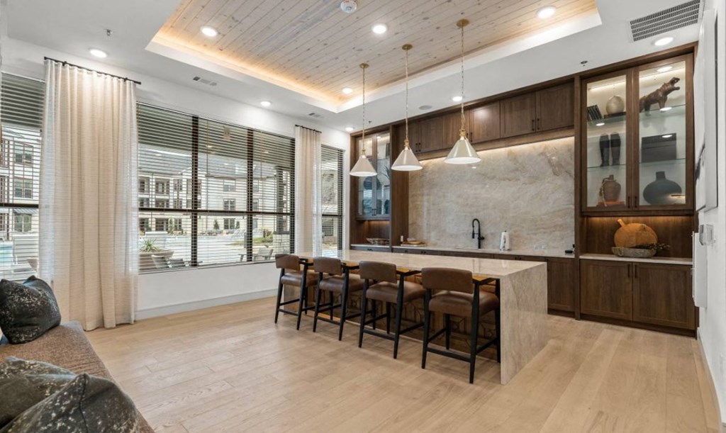 the kitchen is open to the living room and dining room