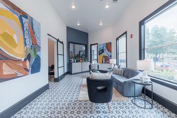 A living room with a blue and white patterned carpet.