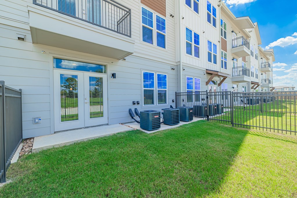 A white building with a blue sky in the background.