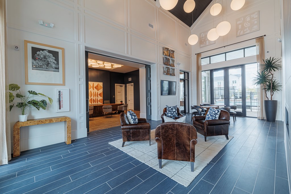 A living room with a dark floor and a white ceiling.