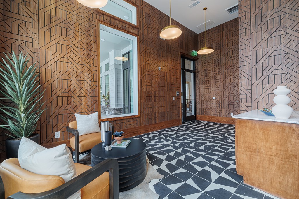 A reception area with a wooden wall and a black and white floor.