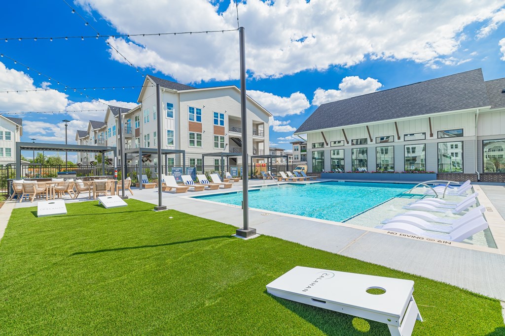 A large white object is on a green lawn.