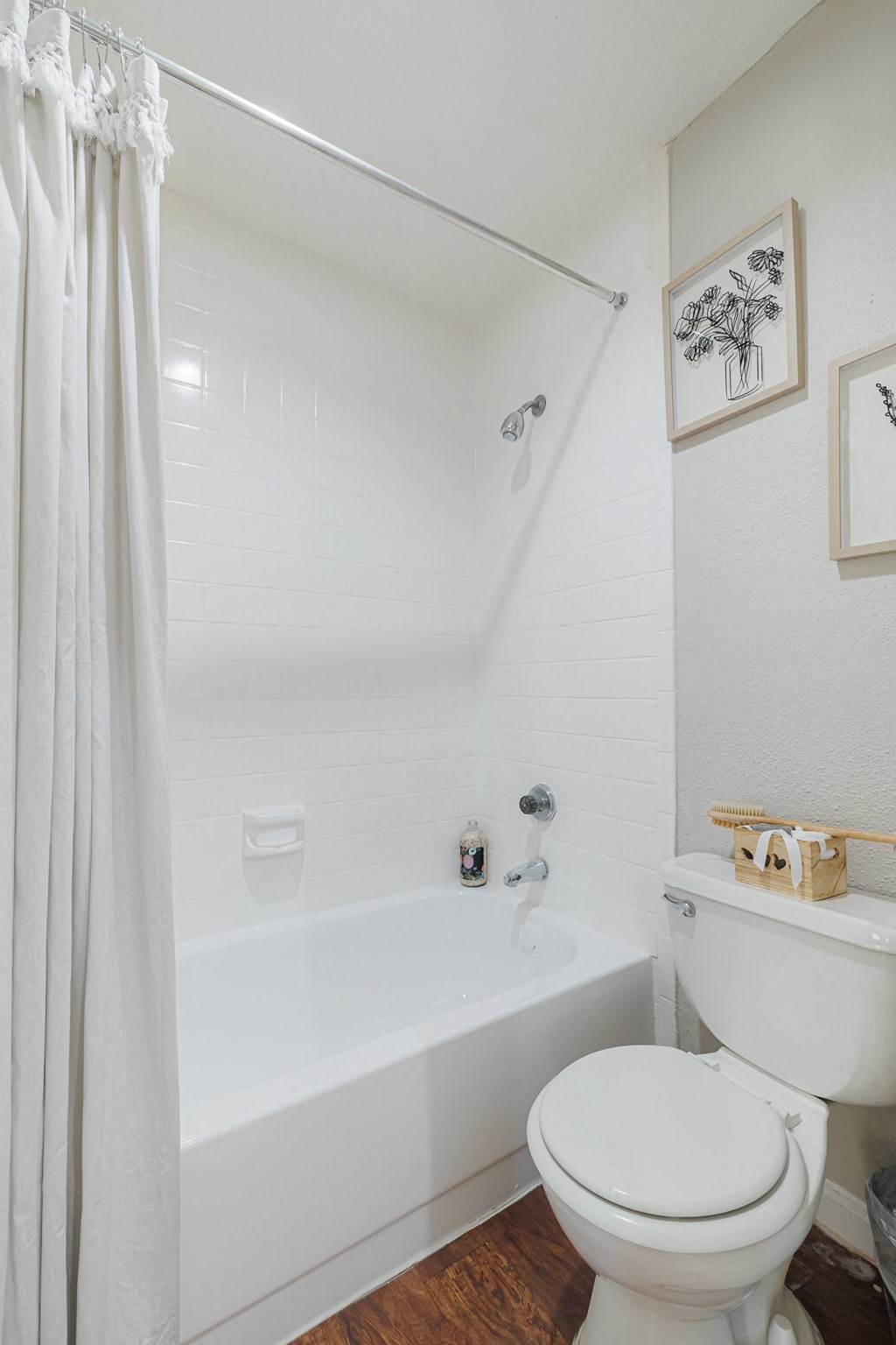 a bathroom with a toilet and a bath tub