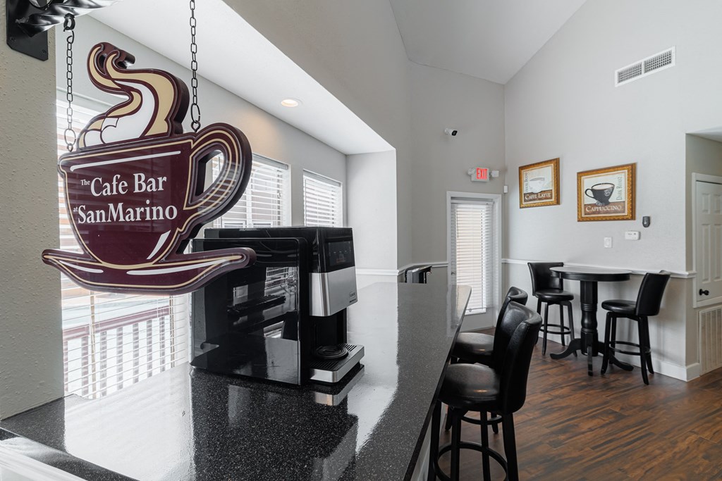 a bar area with a coffee bar and a sign for the cafe bar san n