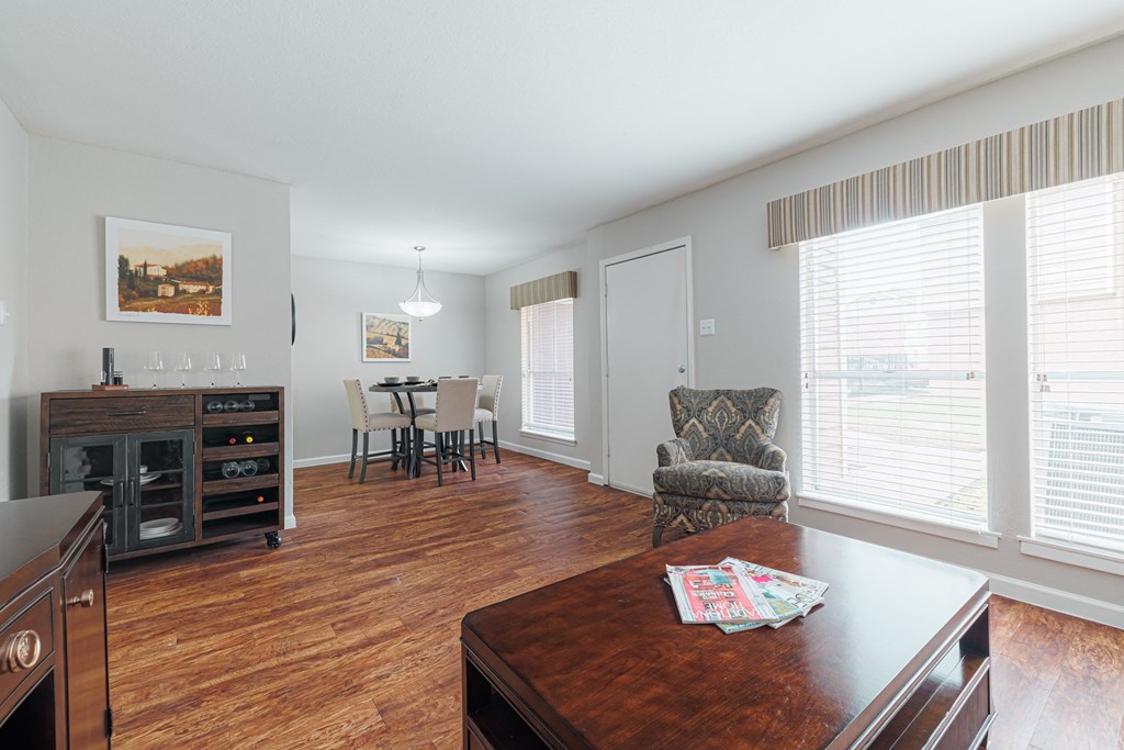 a view of the living room from the dining room and kitchen of an apartment