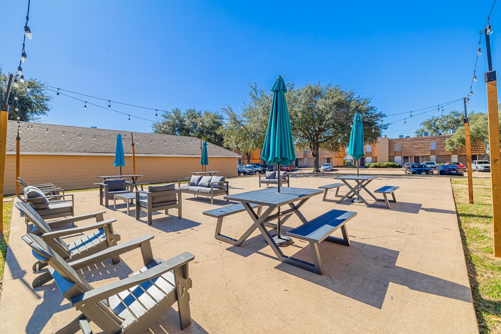 A sunny day at the outdoor seating area with tables and chairs.