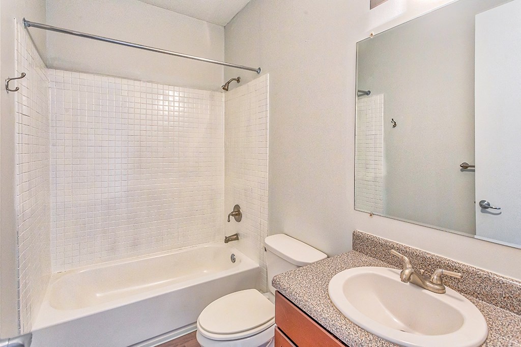 a bathroom with a sink toilet and bathtub