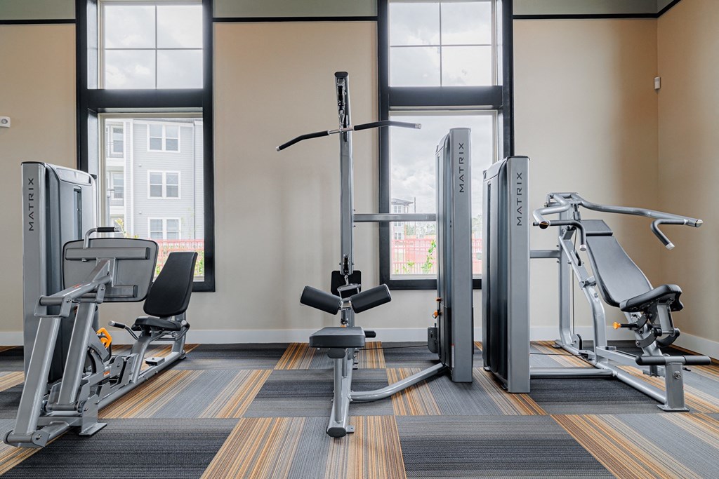 a fitness center with treadmills and other exercise equipment