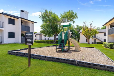 a playground at the whispering winds apartments in pearland, tx