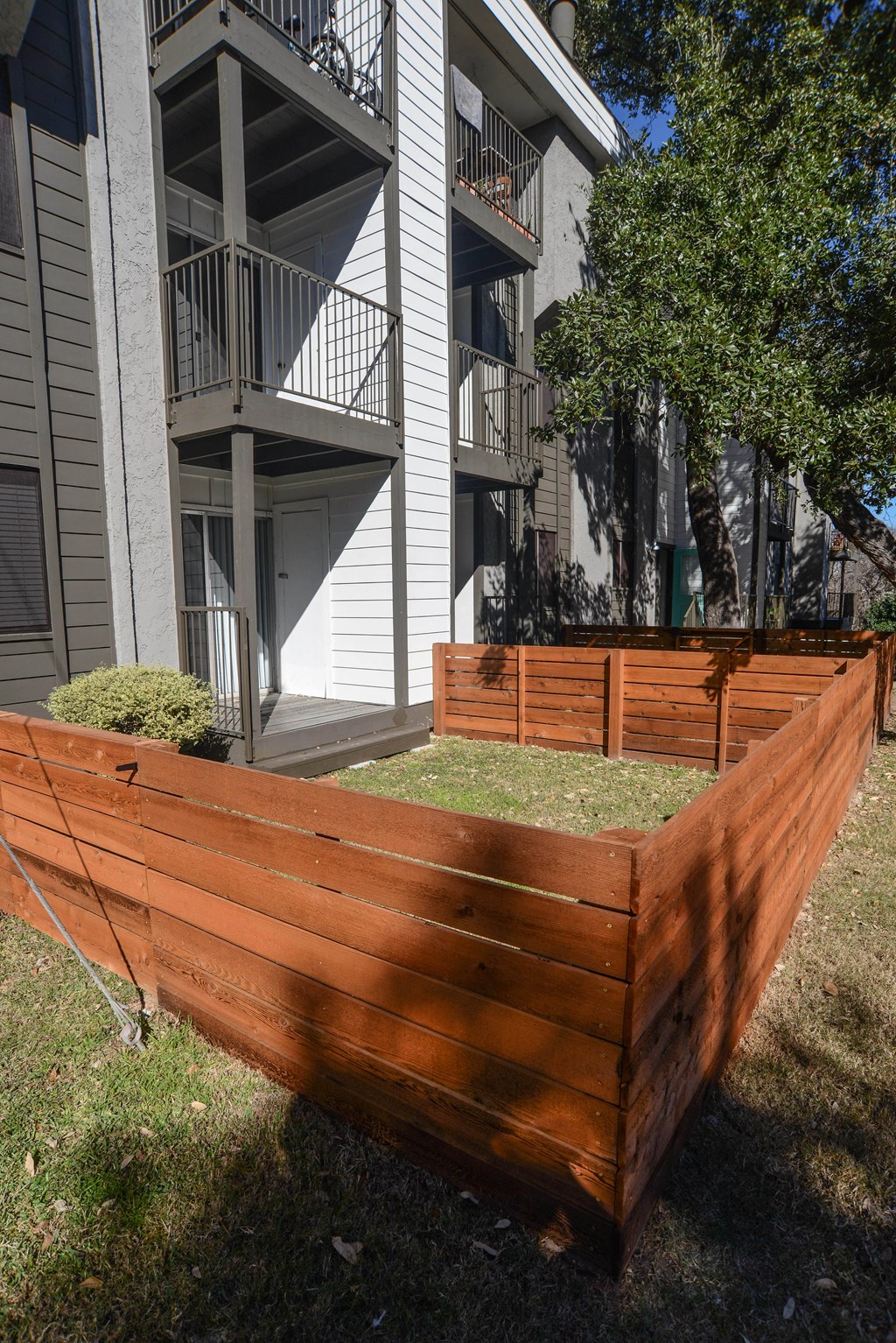 a wooden fence in front of a house