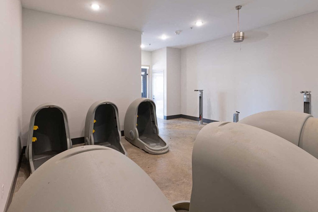 a room with white walls and concrete floors